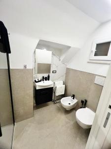 a bathroom with a toilet and a sink at Buonaventura house in Triggiano +41 photos