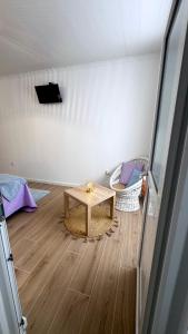 a room with a table in the middle of a room at Raiz Atlântica in Angra do Heroísmo