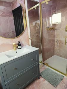 a bathroom with a sink and a shower at Room FULHAM TF2 in London