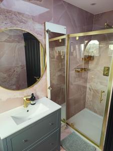 a bathroom with a sink and a shower at Room FULHAM TF2 in London