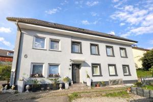 a white house with a lot of windows at Ferienwohnung AyNa 4, direkt an der Schweizer Grenze in Bad Säckingen