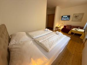 a bedroom with two beds with towels on them at Dobersbergerhof in Dobersberg