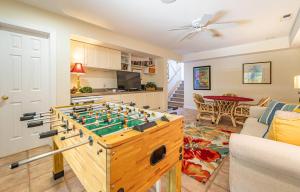 a living room with a foosball table at Crow's Nest - Corolla, Crown Point, 150 Yds to Beach, Hot Tub, Community Pool, Pets OK in Corolla