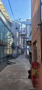 an empty street in a city with a building at Apartman Lori M sa parkingom in Kraljevo