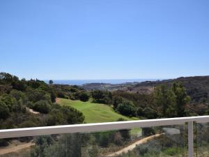 a view of the golf course from the balcony at Belvilla by OYO Miraval in Sitio de Calahonda