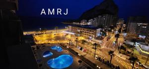 a city at night with the words amu on it at APTO Acceso Directo Playa La Fossa Calpe in Calpe