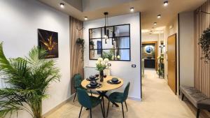 a dining room with a table and chairs at Park & Seafront Pescara in Montesilvano