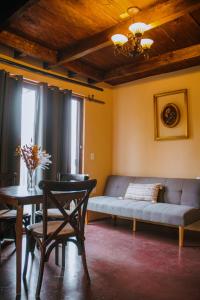 a living room with a couch and a table at La Magia del Bosque in Puebla