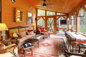 a living room with a couch and a table at Boulder Dreams! Mtn-View Gem in McLeod in McLeod