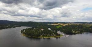 an island in the middle of a large body of water at Apartmány v Buši in Buš