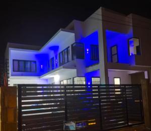 a house is lit up blue at night at D'eaU BleU Villa-Private pool in Pereybere