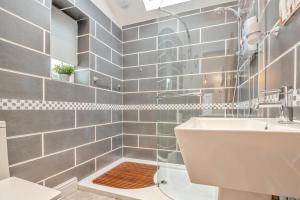a bathroom with a sink and a toilet and a mirror at 3 Bed in Abersoch oc-c33667 in Abersoch +21 photos