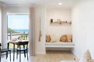 a living room with a couch and a table at The Nook in Aldinga Beach