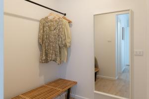 a dress hanging on a wall next to a mirror at The Nook in Aldinga Beach +52 photos