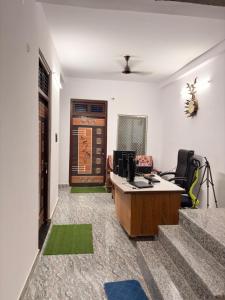 an office with a desk with a computer on it at Shree Rameshth Homestay in Ayodhya
