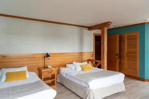 Llit o llits en una habitació de Hotel Puelche 91 fotos més