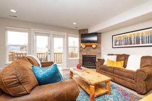 a living room with two couches and a fireplace at Powder Mtn Retreat MH110 Near Powder Mtn Hot Tub in Eden +42 photos