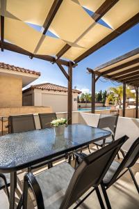 a blue table and chairs on a patio at Elia House In Kapparis in Paralimni