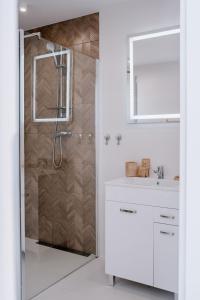 a bathroom with a shower and a sink at Apartamenty Pienińska Aura in Czorsztyn +31 photos