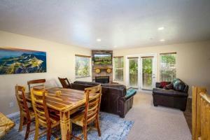 a living room with a table and a couch at Ski Paradise MH 303 Near Powder Mtn Hot Tub in Eden +45 photos