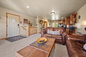 a living room with leather couches and a table at Eden Mtn Retreat MH207 Near Powder Mtn Hot Tub in Eden