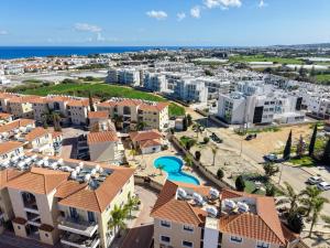 an aerial view of a resort with a pool at Elia House In Kapparis in Paralimni