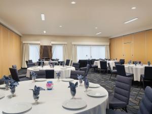 a conference room with tables and chairs and tablesktop at Courtyard Santa Fe in Santa Fe +59 photos