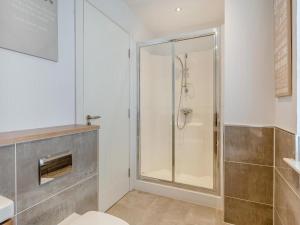 a bathroom with a shower with a glass door at One The Loan in Inverness +10 photos