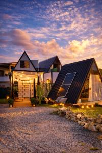 a house with a solar panel on the front of it at Hotel Pousada Chalé Do Rei in Porto Belo