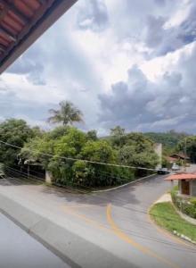 a view of a street from a vehicle at Cantinho dos Pássaros Centro Penedo RJ in Penedo