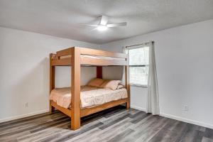 a bedroom with a bunk bed and a window at Sun, Sand & Poolside Relaxation! Ormond Beach Unit in Ormond Beach +21 photos