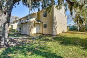 a house with a tree in front of it at Sun, Sand & Poolside Relaxation! Ormond Beach Unit in Ormond Beach