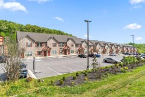a large parking lot with a large building at Properties by Preston I 2Bd2bth Townhome in Clarksville