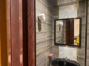 a bathroom with a sink and a mirror at Shaheen hotel in Suez