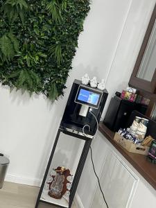 a camera on a stand with a laptop on it at Uniri Urban Escape in Craiova