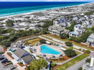 an aerial view of a resort with a pool and the beach at Barefoot at the Beach in Watersound Beach