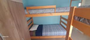 a small room with two bunk beds in it at Quillon cabañas in Quillón