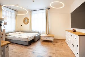 a bedroom with a bed and a large window at Brunova Vila in Plavy