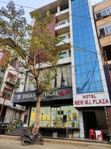 a motorcycle parked in front of a building at Hotel New M I Plaza in Gaya