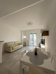 a living room with a table and a couch at Soul house in Corsico