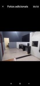 a picture of a bathroom with a tile floor at Recanto do Garças in Aragarças
