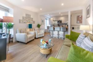 a living room with a couch and a table at 2 Bed in Penzance oc-u34133 in Penzance +7 photos