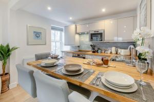 a kitchen and dining room with a table and chairs at 2 Bed in Penzance oc-u34133 in Penzance