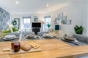 a living room with a table with plates and glasses at 2 Bed in Penzance oc-u34133 in Penzance