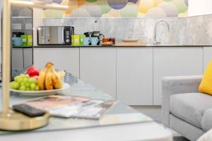 a table with a bowl of fruit on top of it at 1 Bed in Penzance oc-u34132 in Penzance +5 photos