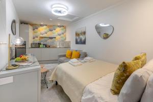 a bedroom with a bed and a living room at 1 Bed in Penzance oc-u34132 in Penzance