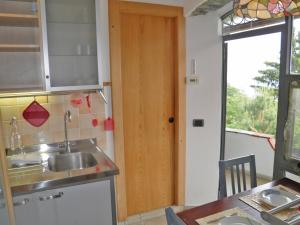 a kitchen with a sink and a counter top at Asti in Gravedona