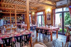 a dining room with tables and chairs in a room at Karczma Kujawska in Inowrocław +31 photos