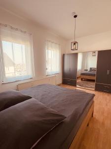 a bedroom with a large bed in a room at Haus an der Linde in Bad Essen
