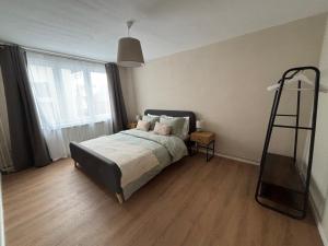 a bedroom with a bed and a ladder in it at Clock in Gheorgheni